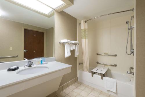 a bathroom with a sink and a tub and a shower at Hampton Inn Wilkesboro in Wilkesboro