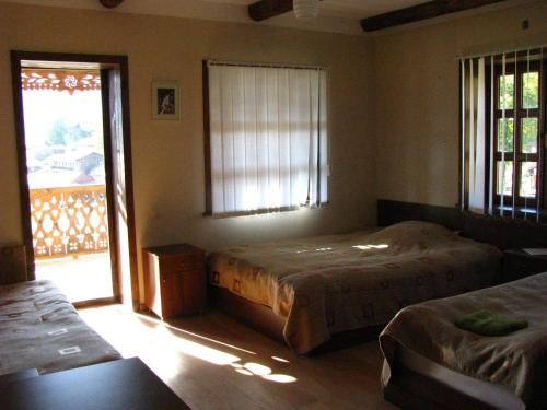 Postel nebo postele na pokoji v ubytování Guest House Shina