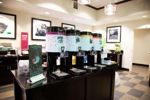 a bunch of bottles of wine sitting on a counter at Hampton Inn & Suites Sharon in West Middlesex