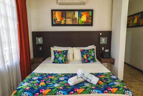 a hotel room with a bed with at Villeta Boutique Hotel Spa in Villeta