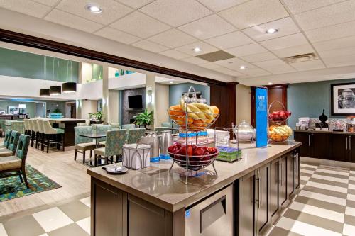 a lobby with a display of fruit on a counter at Hampton Inn Sudbury, Ontario in Sudbury