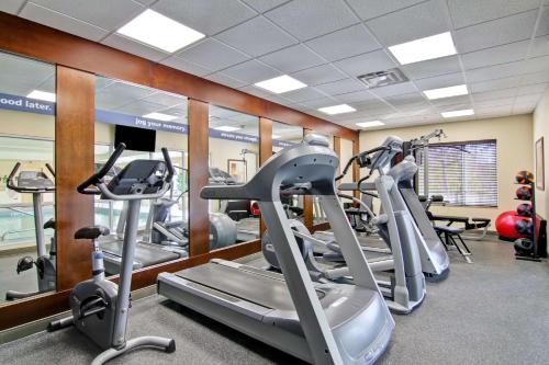 a gym with several treadmills and cardio machines at Hampton Inn Sudbury, Ontario in Sudbury