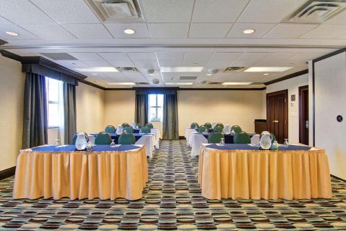 a room with rows of tables and chairs in it at Homewood Suites by Hilton Toronto Mississauga in Mississauga