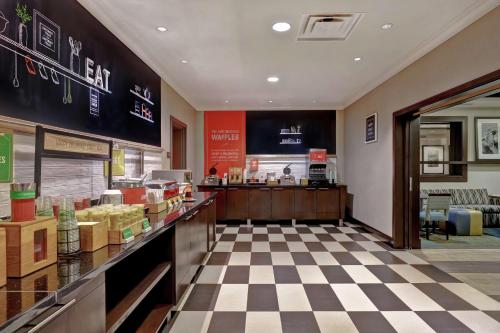 a fast food restaurant with a checkered floor at Hampton Inn by Hilton Toronto Airport Corporate Centre in Toronto