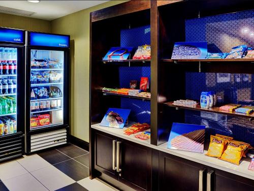 a store with shelves filled with different types of food at Hampton Inn by Hilton Winnipeg in Winnipeg