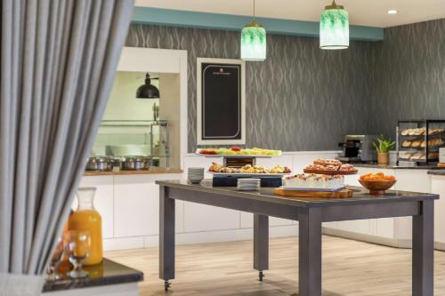a table with food on it in a kitchen at Hilton Garden Inn Troy in Troy