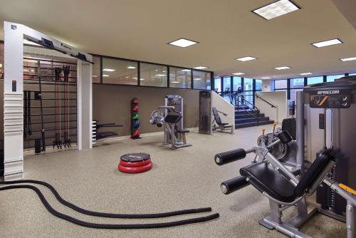 a fitness room with a gym with a treadmill at Hilton Anchorage in Anchorage