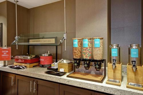 a kitchen counter with various food items on it at Hampton Inn Atlanta-Mall Of Georgia in Buford