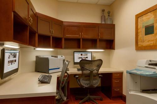 an office with a desk with a computer and a chair at Hilton Garden Inn Atlanta Marietta in Atlanta