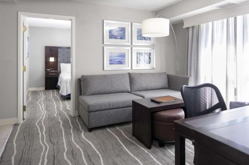 a living room with a couch and a table at Homewood Suites by Hilton Columbia in Columbia