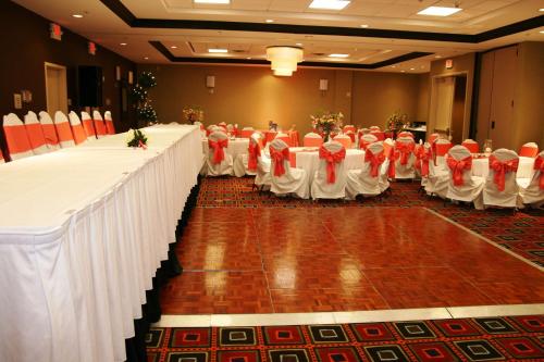 a row of tables and chairs in a room at Hilton Garden Inn Birmingham/Trussville in Trussville