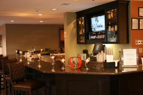 a bar in a restaurant with wine glasses at Hilton Garden Inn Birmingham/Trussville in Trussville