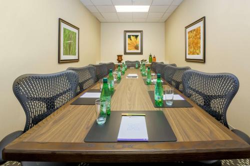 a conference room with a long table with bottles on it at Hilton Garden Inn Bakersfield in Bakersfield