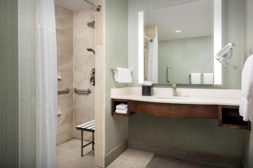 a bathroom with a sink and a mirror at Hilton Garden Inn Murfreesboro in Murfreesboro