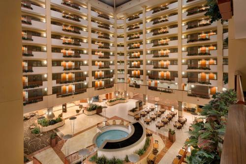 an overhead view of a large building with a pool at Embassy Suites by Hilton Nashville South Cool Springs in Franklin