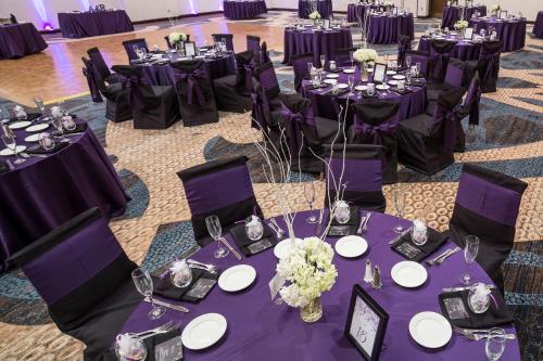 a group of tables and chairs in a banquet hall at DoubleTree by Hilton Boston-Milford in Milford
