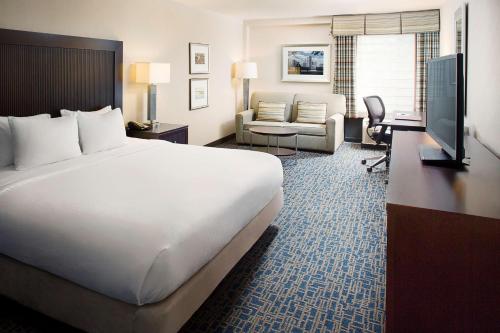 a hotel room with a large bed and a television at DoubleTree by Hilton Baltimore - BWI Airport in Linthicum Heights