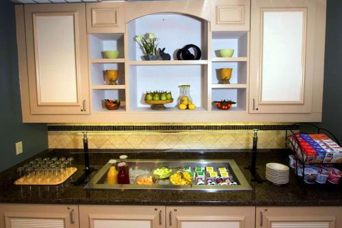 a kitchen counter with a tray of food at Hilton Garden Inn Aberdeen in Aberdeen