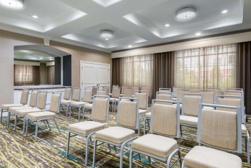 a room with rows of chairs and a podium at Homewood Suites by Hilton Buffalo-Amherst in Amherst