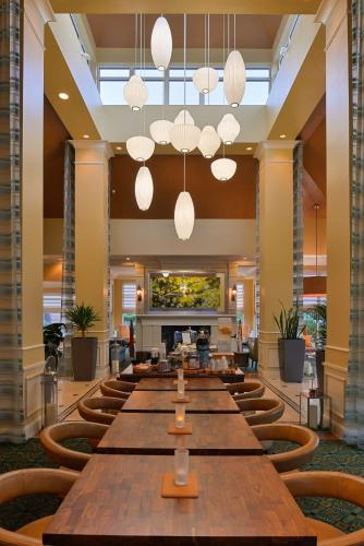 a large conference room with a long table and chairs at Hilton Garden Inn Columbia in Columbia