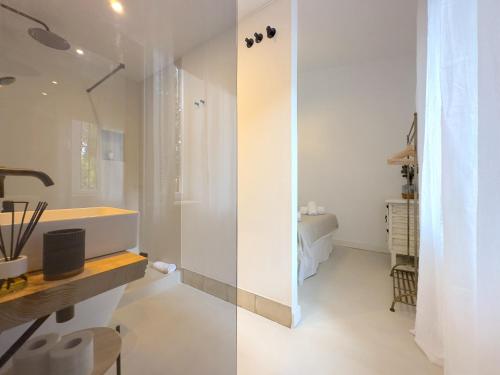 a white bathroom with a sink and a shower at VILLA CLAVERO FOUR Premium Apt in Málaga