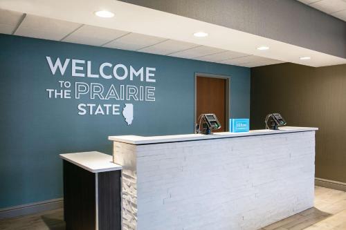 a welcome to the prairie state sign on a wall at Hampton Inn Freeport in Freeport
