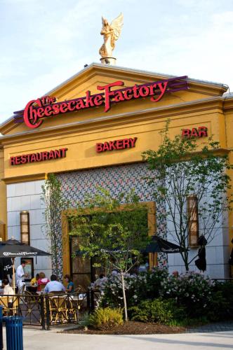 a restaurant with a sign on top of a building at Hilton Columbus at Easton in Columbus