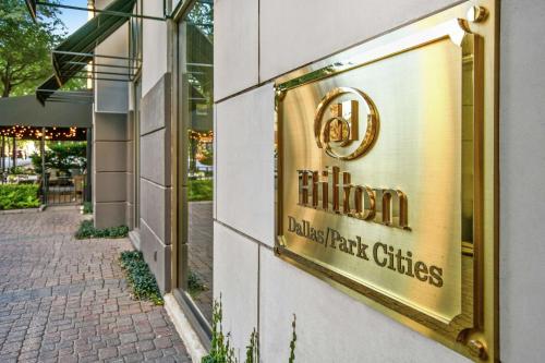 a sign for a restaurant on the side of a building at Hilton Dallas-Park Cities in Dallas
