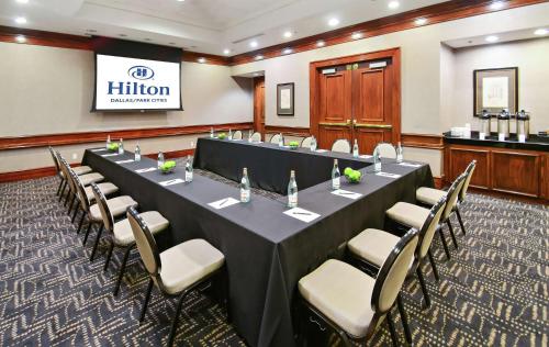 a conference room with a long table and chairs at Hilton Dallas-Park Cities in Dallas