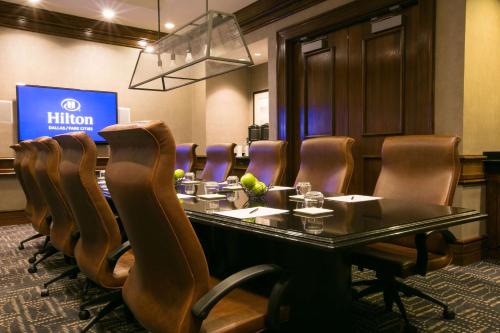 a conference room with a long table and chairs at Hilton Dallas-Park Cities in Dallas