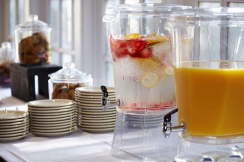 a blender filled with fruit and a drink on a table at DoubleTree by Hilton Dallas Near the Galleria in Dallas