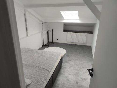 a bedroom with two beds and a skylight at Zara at Saint Raphael France in Saint-Raphaël