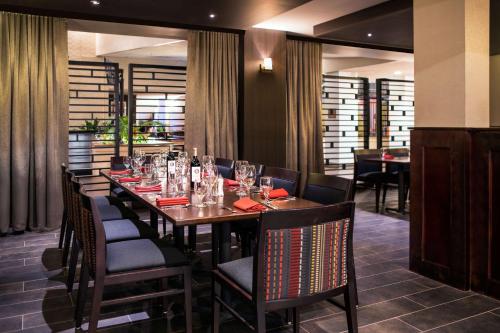 a dining room with a long table and chairs at DoubleTree by Hilton Denver Tech in Greenwood Village