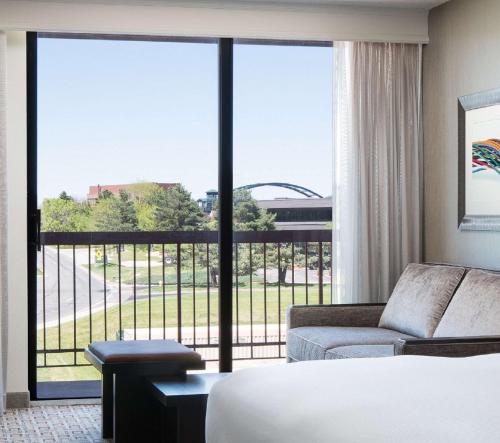 a hotel room with a bed and a large window at DoubleTree by Hilton Denver Tech in Greenwood Village