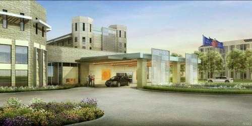 a rendering of a building with a car garage at DoubleTree by Hilton Hotel Denver - Thornton in Thornton