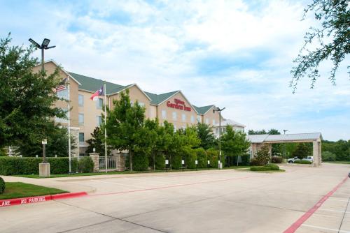 a rendering of the front of a hotel at Hilton Garden Inn Denton in Denton