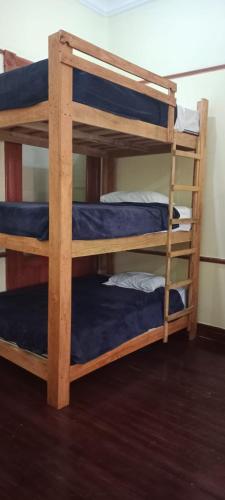 a pair of bunk beds in a room at Hostal T M in Mexico City