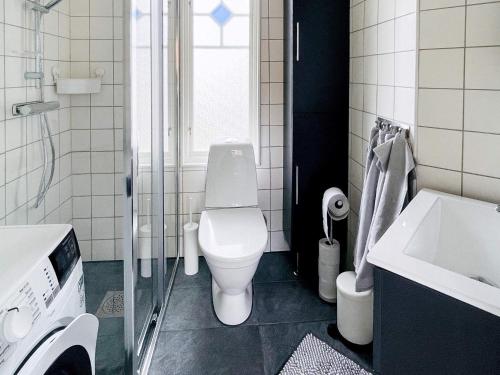 a bathroom with a toilet and a sink at Holiday home BRäNNö in Brännö