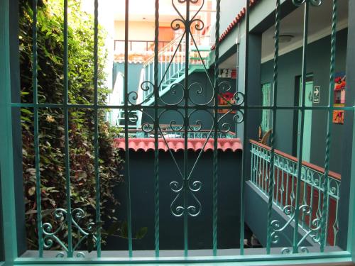 a gate in front of a building at La Casona Azul in Lima