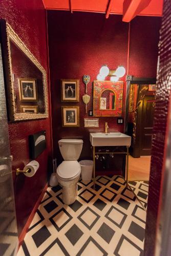 a bathroom with a toilet and a sink at The Rosemary in Los Angeles