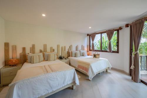 Cama o camas de una habitación en Ana y Jose Hotel & Beach Club Tulum