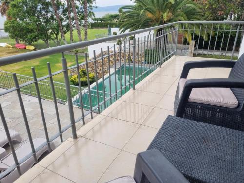 a balcony with a view of a swimming pool at Hotel La Ribereña in Ajijic