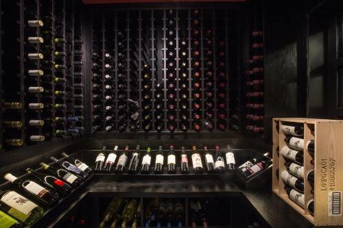 a wine cellar with a bunch of bottles of wine at The Frobisher Inn in Iqaluit