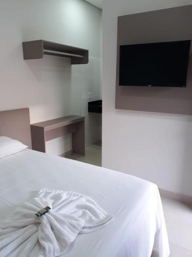 Ένα ή περισσότερα κρεβάτια σε δωμάτιο στο NOROESTE Comfort Hotel