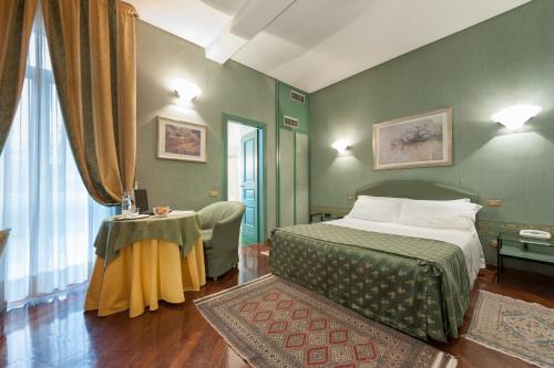 Vuode tai vuoteita majoituspaikassa Hotel Villa Giulia