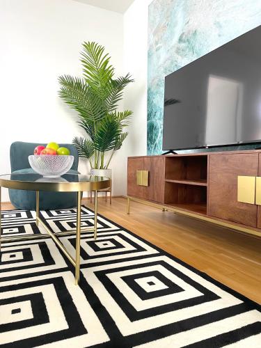 Traunseeresidenzenにあるテレビまたはエンターテインメントセンター