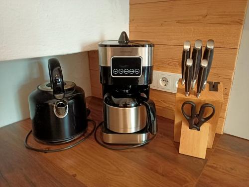 a coffeemaker and a coffee maker on a counter at Appartements Bergheim in Hirschbichl