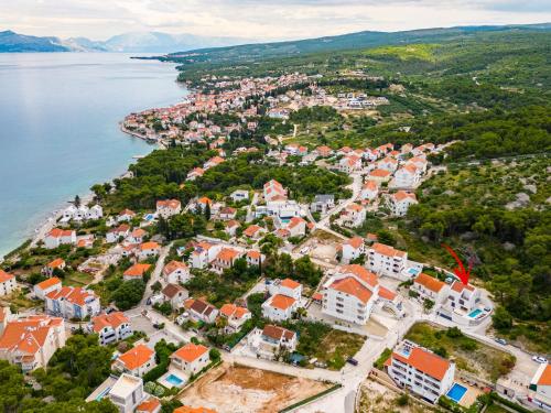 an aerial view of a small town next to the water at Villa Dono in Sutivan