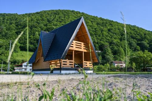 a house with a roof with solar panels on it at Bungalow Jajce 1 in Jezero