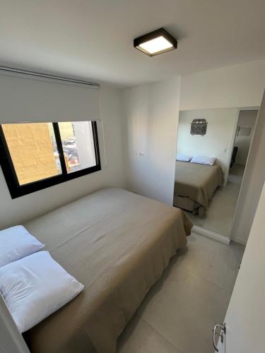 Katil atau katil-katil dalam bilik di Studio inteiro ótima localização centro
